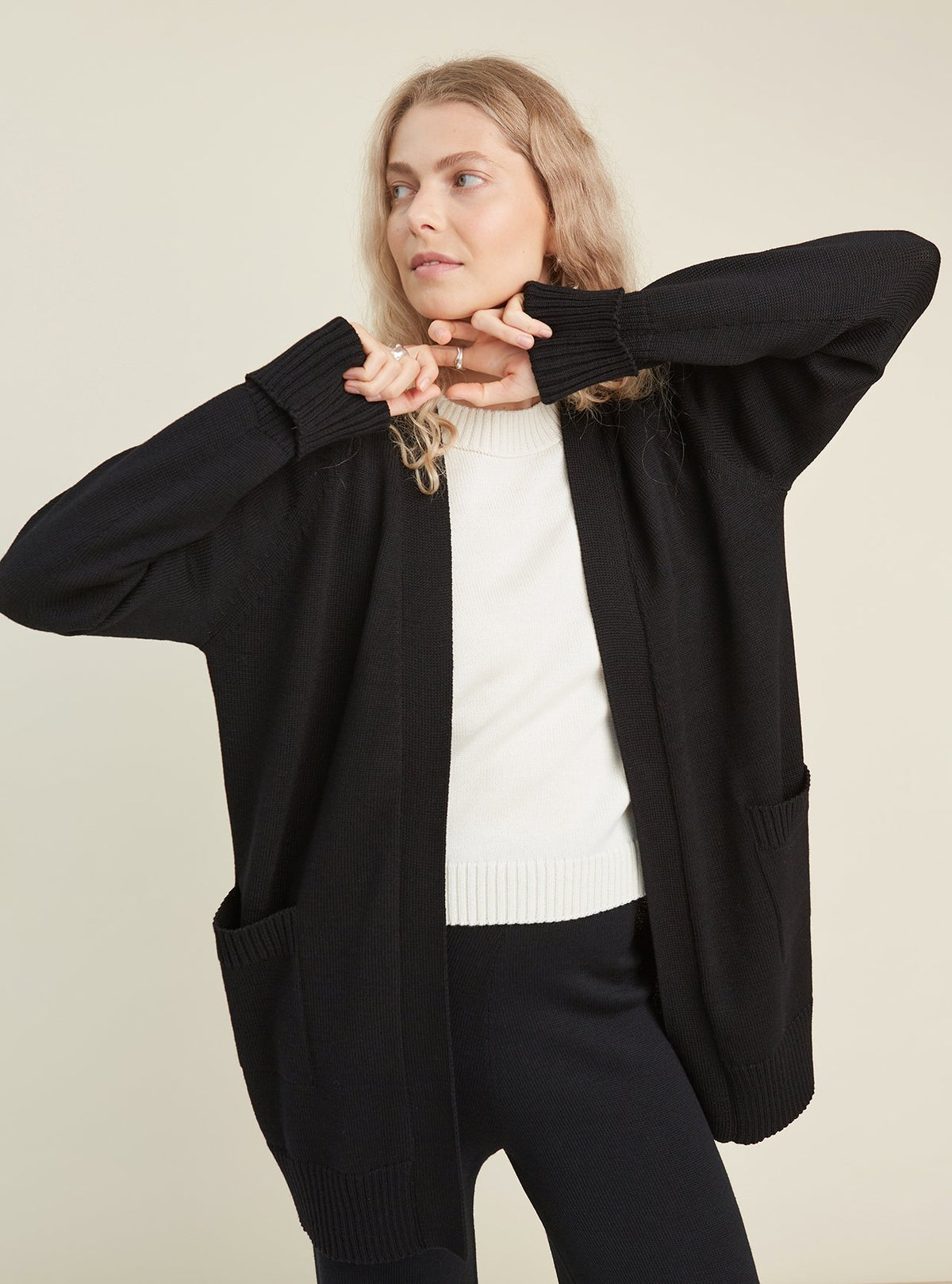 Monala belted merino wool cardigan with pockets in black, women, front view