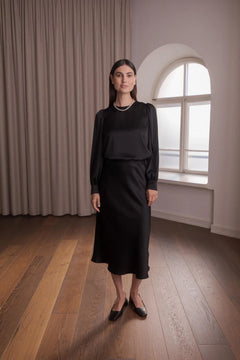 Black satin blouse with puff sleeves, front view