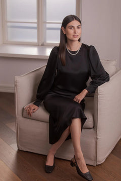 Close-up of black satin puff sleeve texture