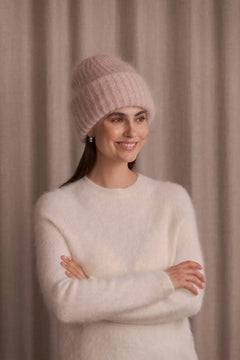 Woman wearing Original Story light pink chunky mohair beanie