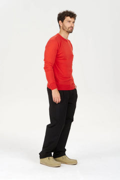 Man wearing Komodo Red organic cotton pocket sweater