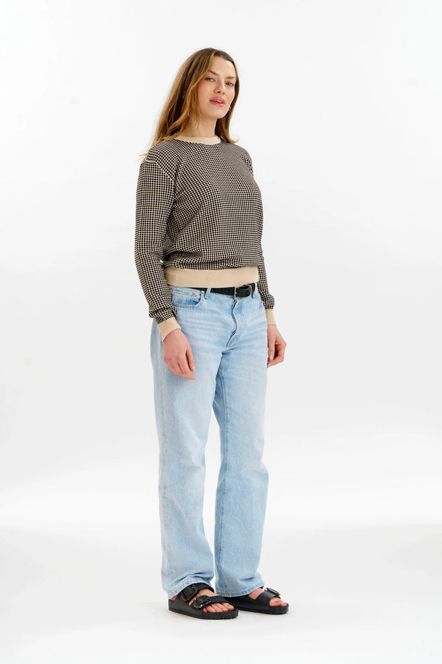 Woman wearing Komodo cream and black jacquard sweater