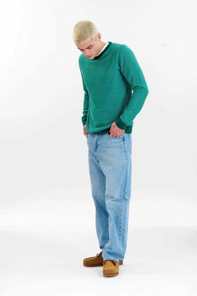 Man wearing Komodo Hasan green organic cotton jacquard sweater