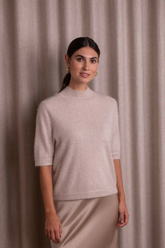 Woman wearing Original Story latte half-turtleneck sweater
