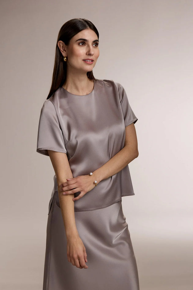 Woman wearing Original Story nougat satin blouse
