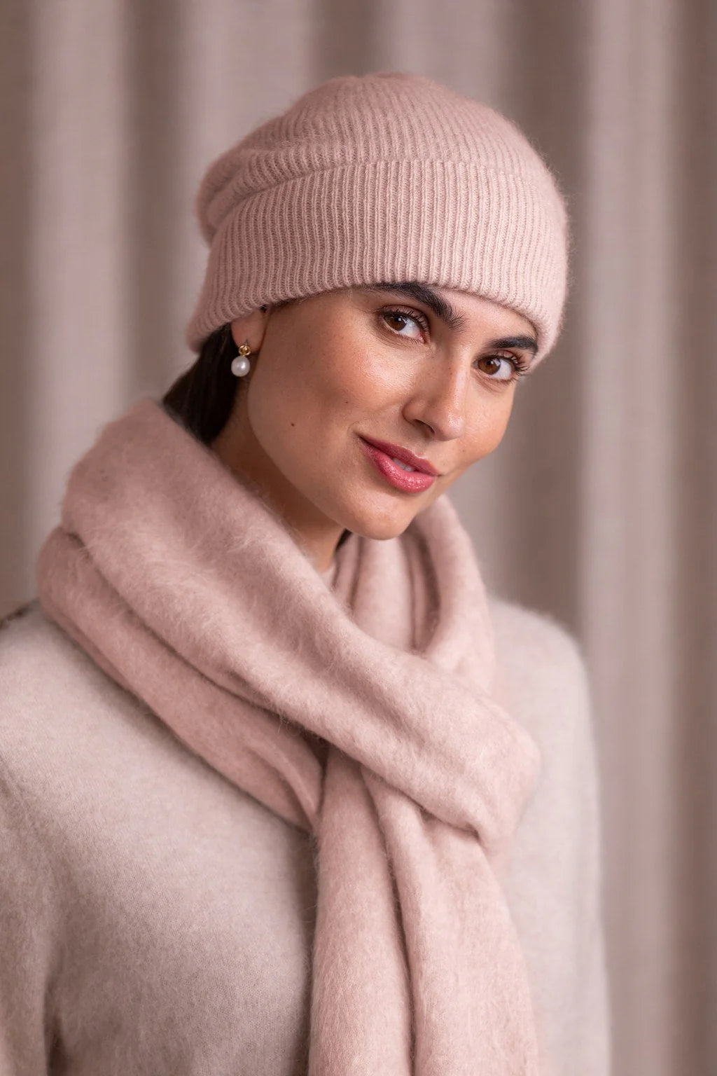 Pale pink cashmere ribbed beanie, front view