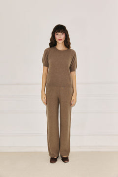 Woman wearing Enteliér taupe knit top