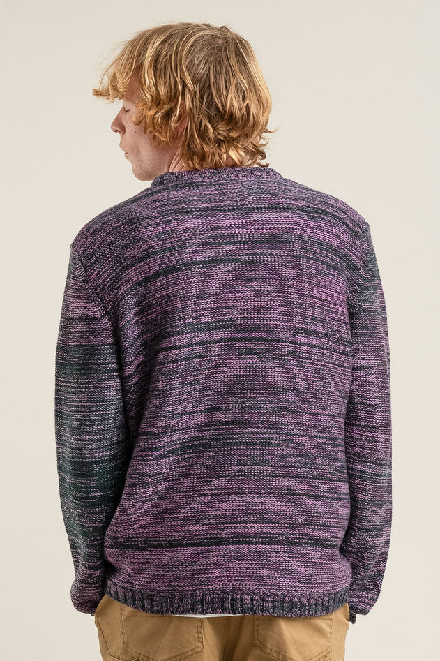 Man wearing Komodo fuchsia merino wool top